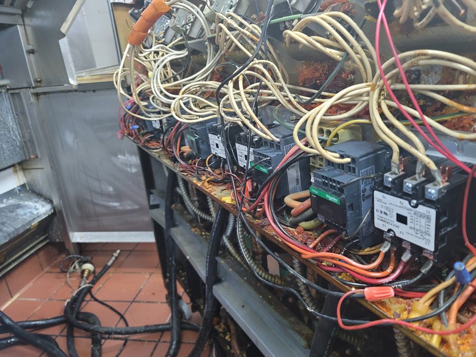 commercial kitchen equipment breakdown due to grease buildup and faulty wiring