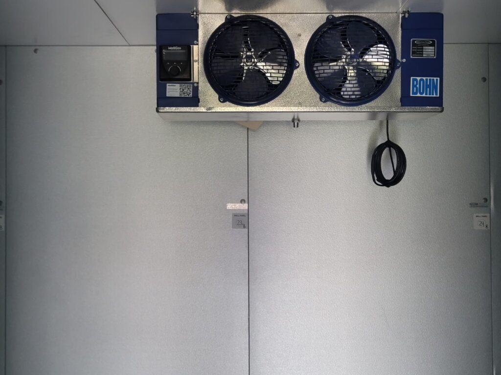 Completed interior — diamond-plate floor, sealed panels, Bohn evaporator