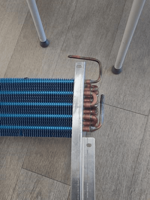 Close-up of the new copper-tube / aluminum-fin evaporator coil before installation