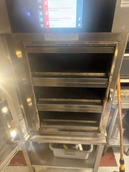 Commercial combi oven — digital controls, preheating in progress