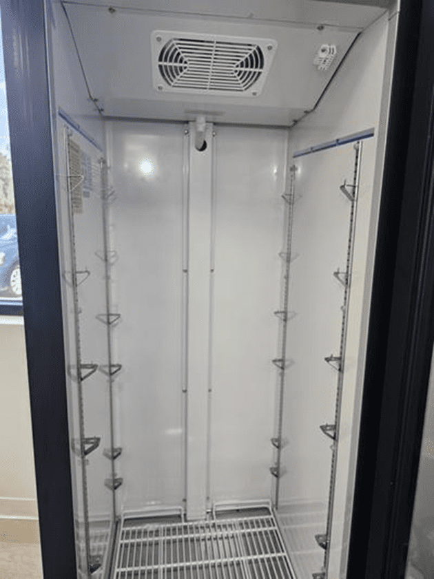 Inside view of a clean, newly serviced commercial reach-in freezer