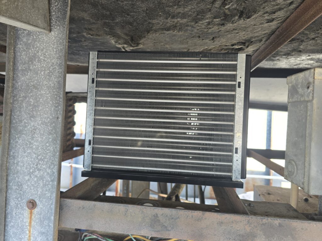 New evaporator coil installed inside Krystal's walk-in cooler ceiling assembly.