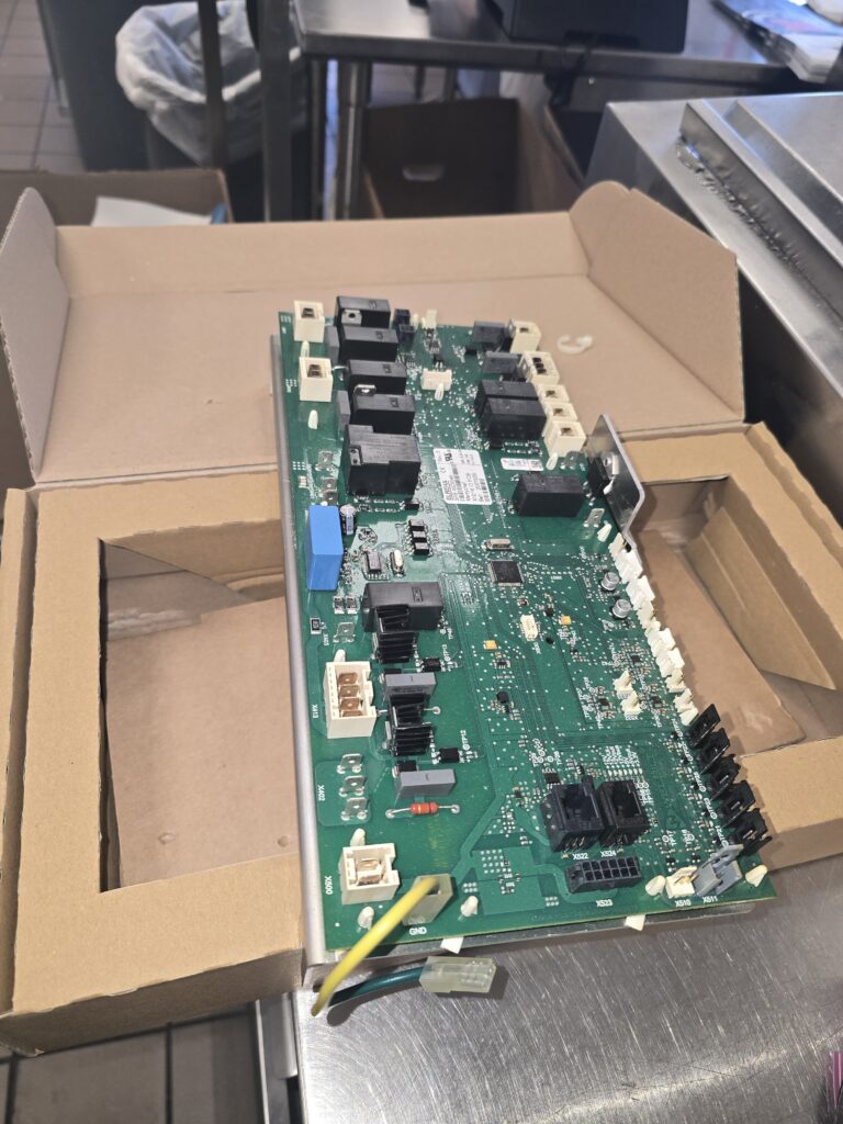 A new replacement motherboard, ready to be installed and tested.