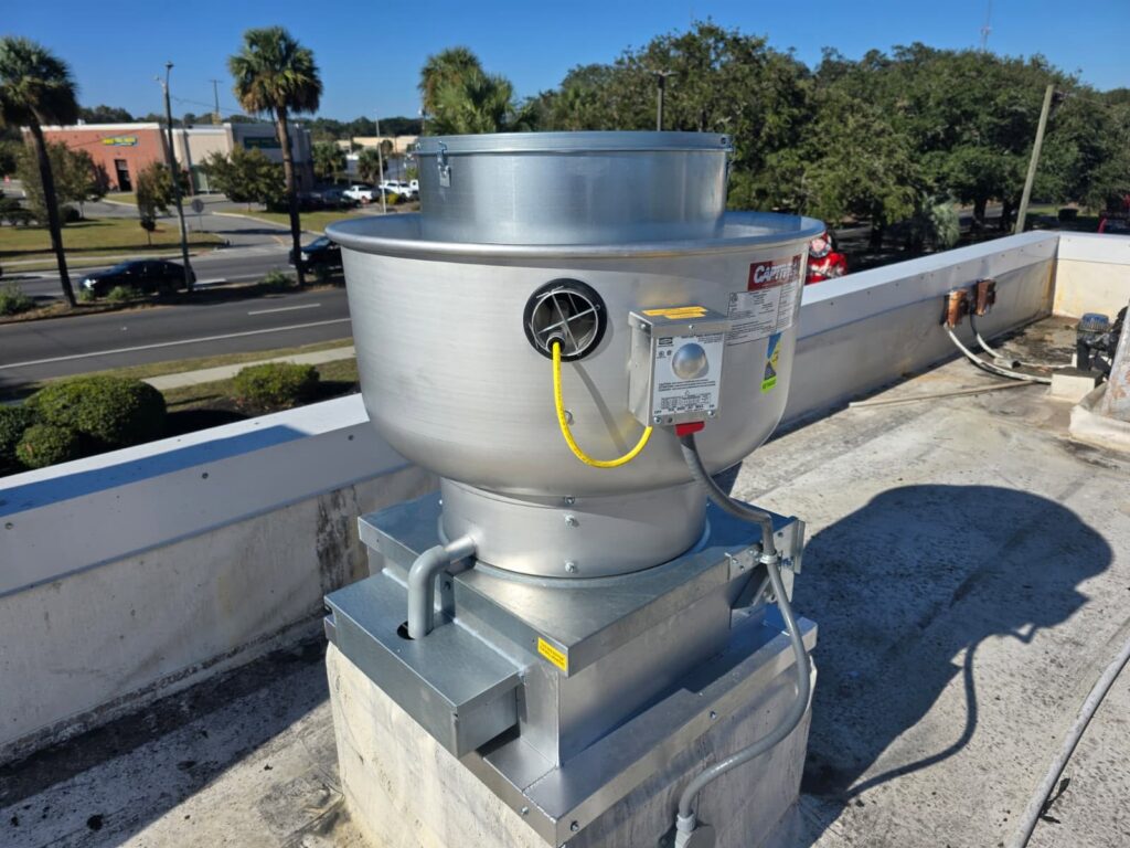 Rooftop exhaust equipment under summer service — clogged or underperforming units strain the whole kitchen.