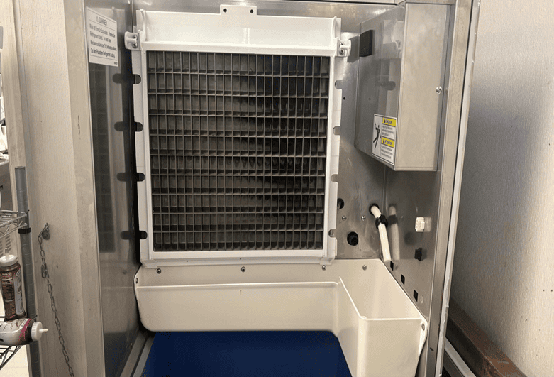 Technicians inspect the evaporator, water distribution system, and condenser during every visit.