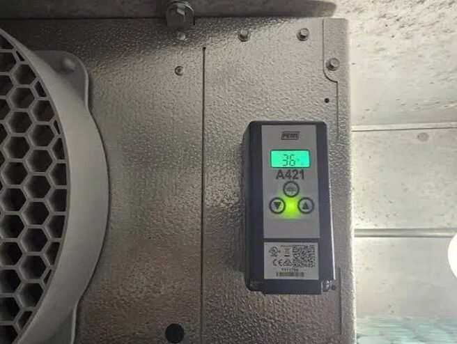 Digital controller reading 36°F — accurate thermostat readings are essential for food safety compliance.