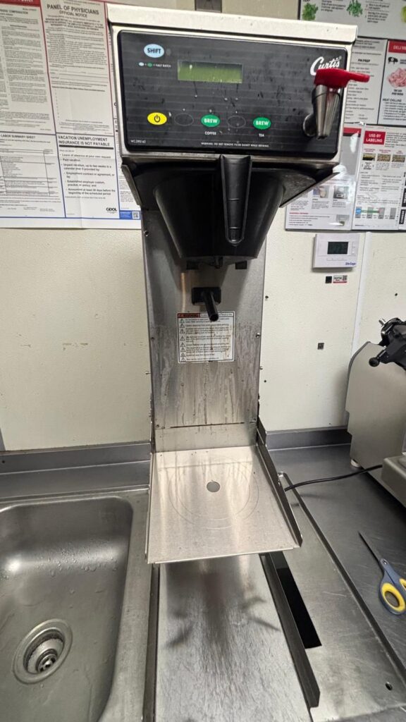 The Curtis coffeetea brewer at the client's location before service began.