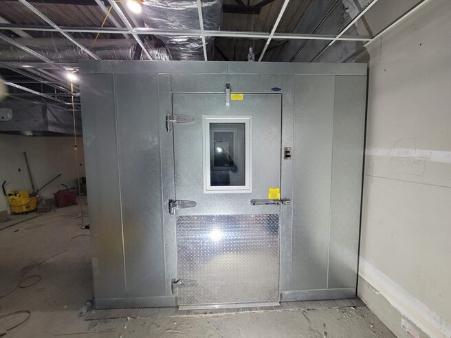 A completed walk-in installation, sealed and ready for service.